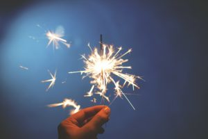 Hiring a Consultant: person holding a sparkler