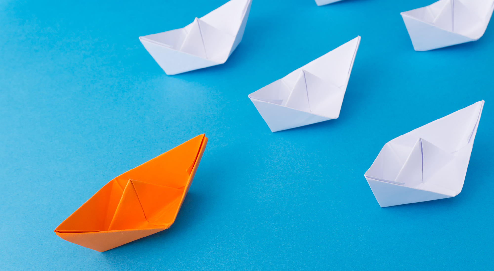 leading a business transformation - paper boats