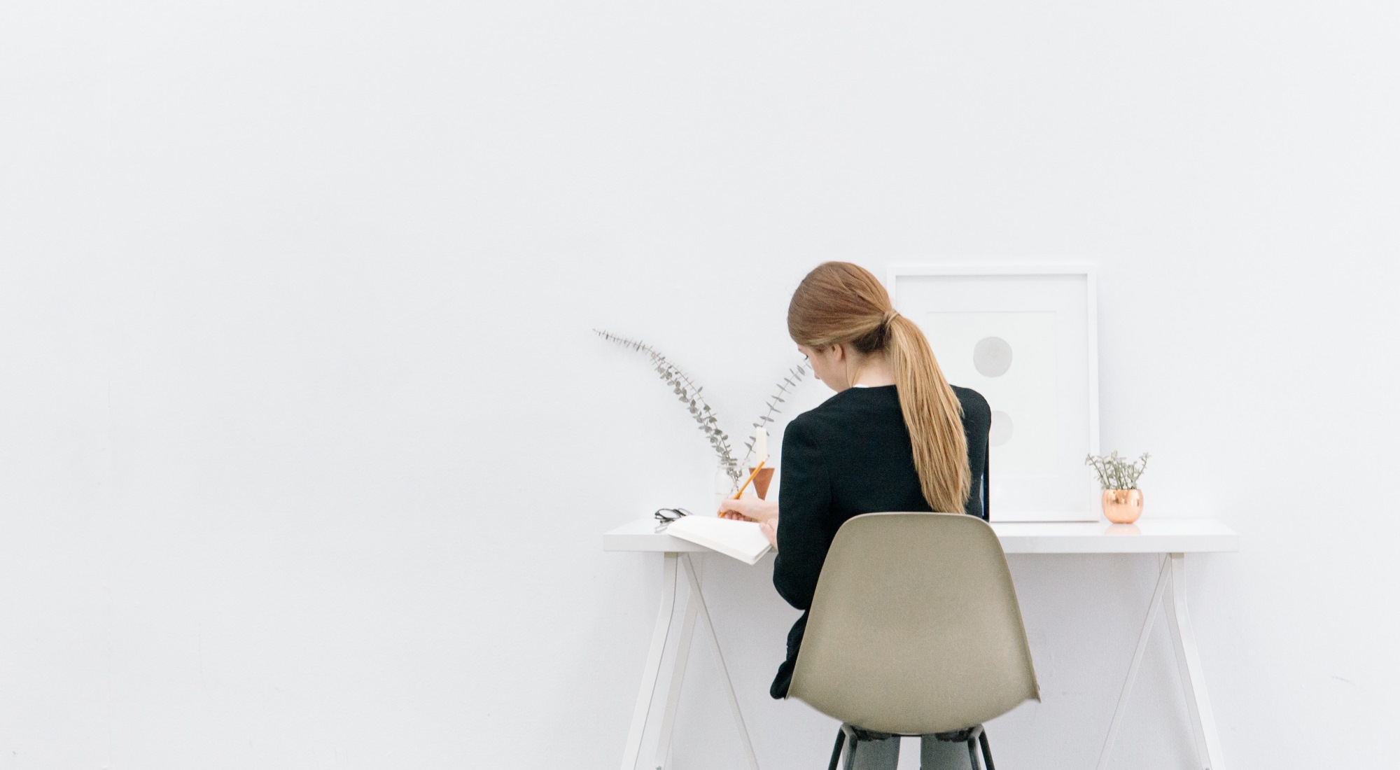 Strategic Planning: woman at desk writing