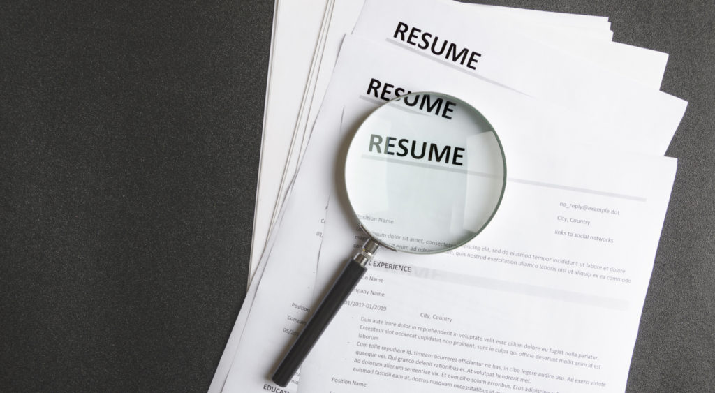 magnifying glass on independent consultant resumes