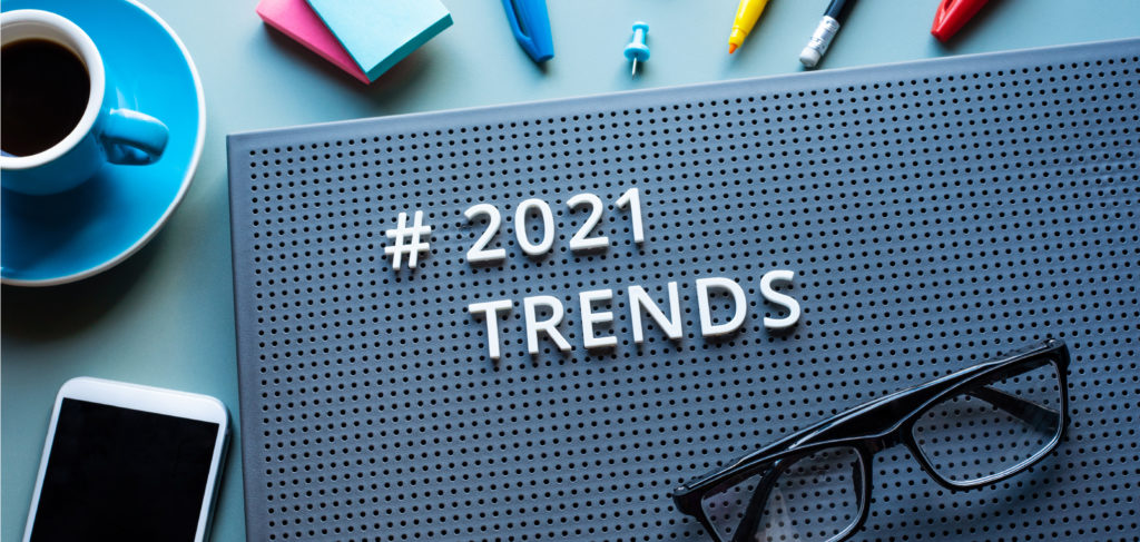 2021 eCommerce Trends - Sign that says "2021 trends" on a desk with other items